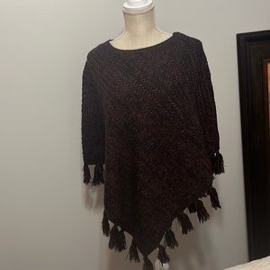 Poncho sweater weave with black and reddish brown yarn. Warm and stylish.